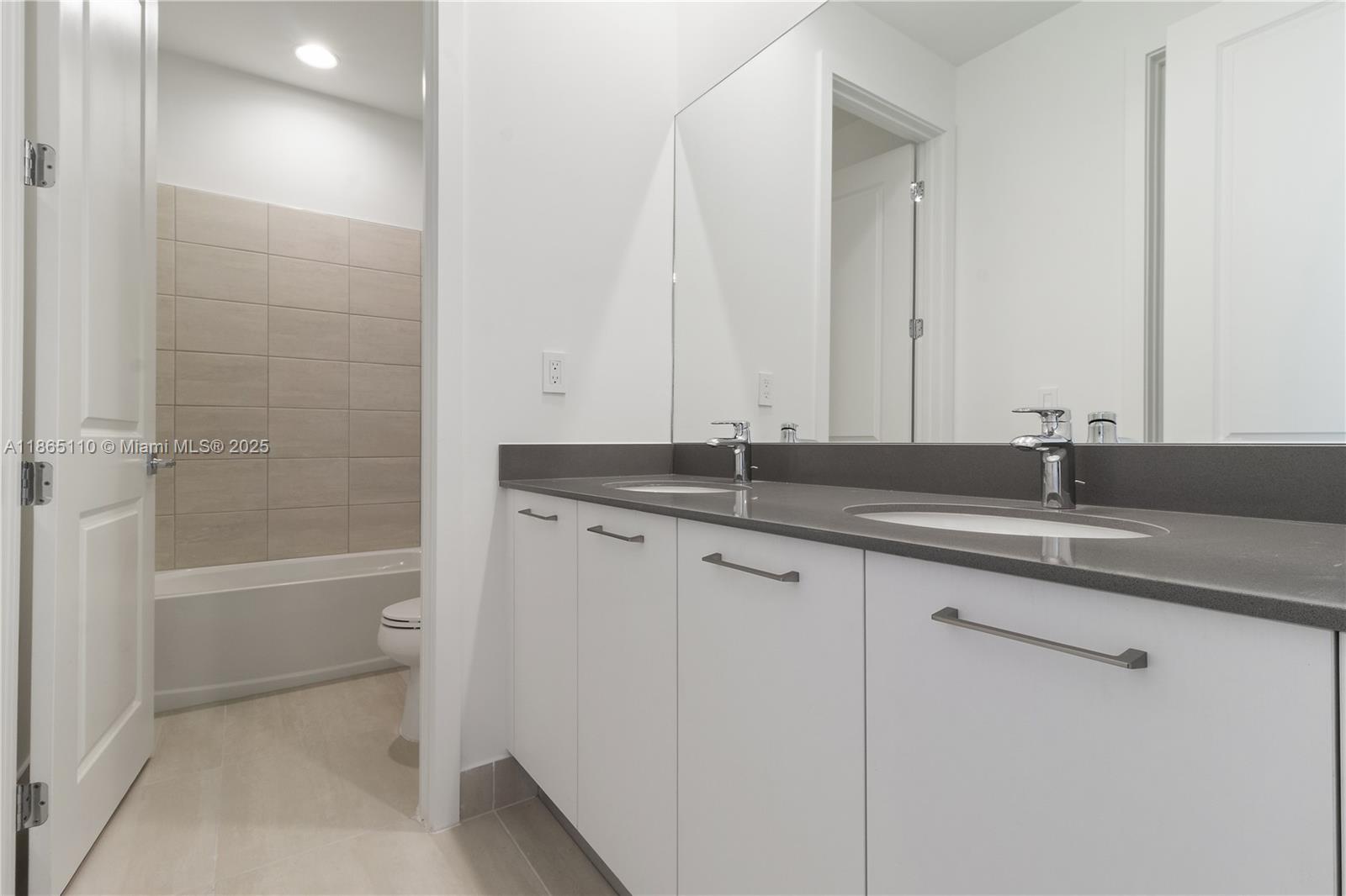 2391 Southwest 123rd Terrace Davie, FL 33325 - Photo 36 of 39 a bathroom with a sink and a mirror