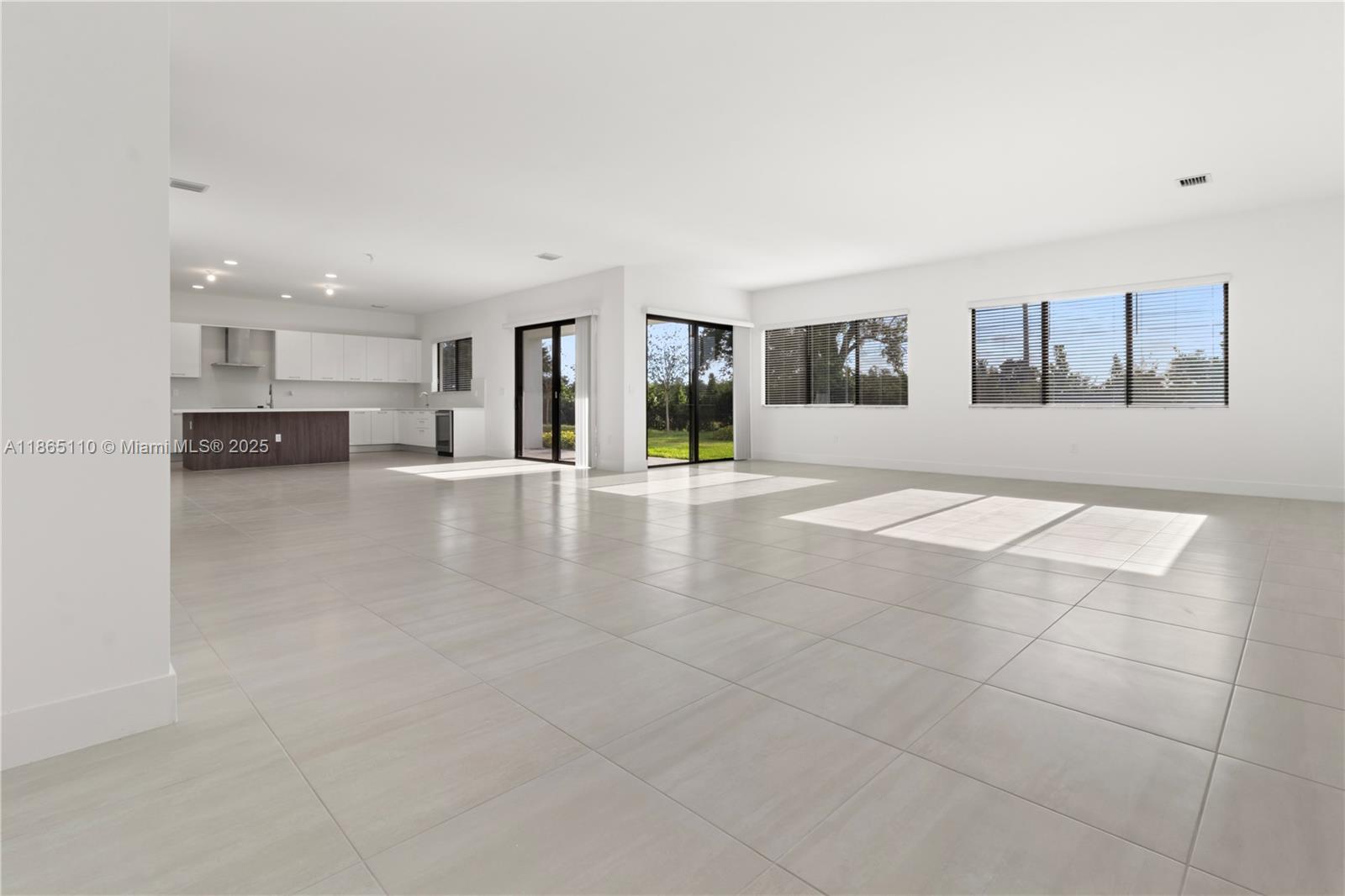 2391 Southwest 123rd Terrace Davie, FL 33325 - Photo 5 of 39 a view of a living room hardwood floor and a kitchen