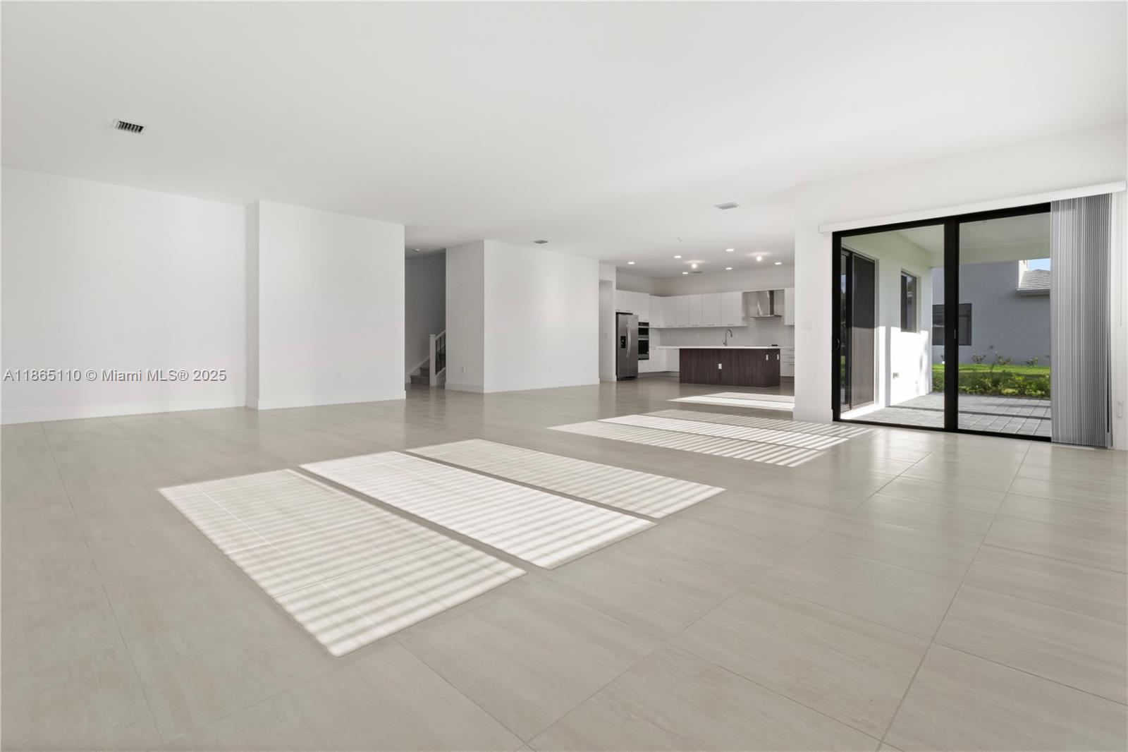 2391 Southwest 123rd Terrace Davie, FL 33325 - Photo 6 of 39 an empty room with fireplace and windows