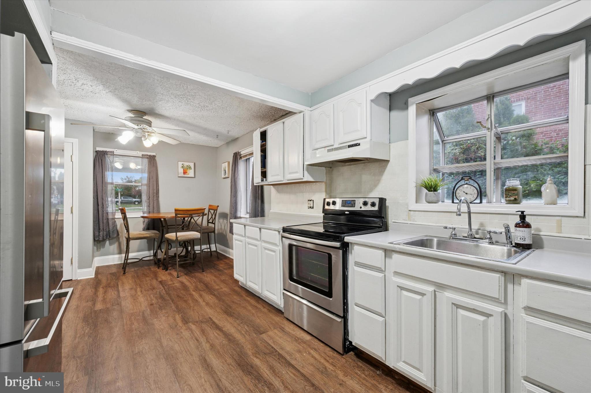 2379 Mole Road Secane, PA 19018 - Photo 11 of 26 a kitchen with a sink cabinets and stainless steel appliances