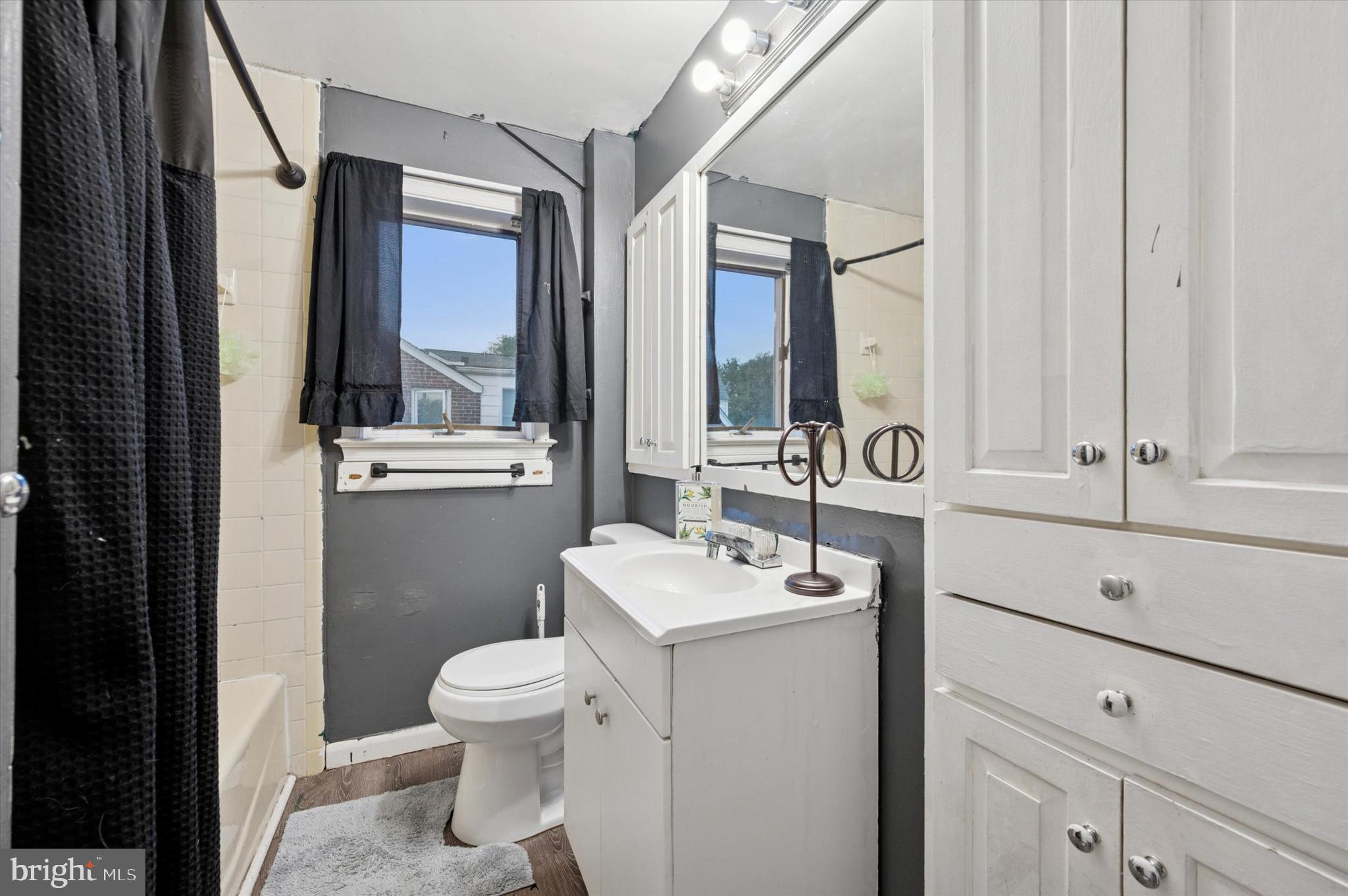 2379 Mole Road Secane, PA 19018 - Photo 17 of 26 a bathroom with a sink a toilet and a mirror