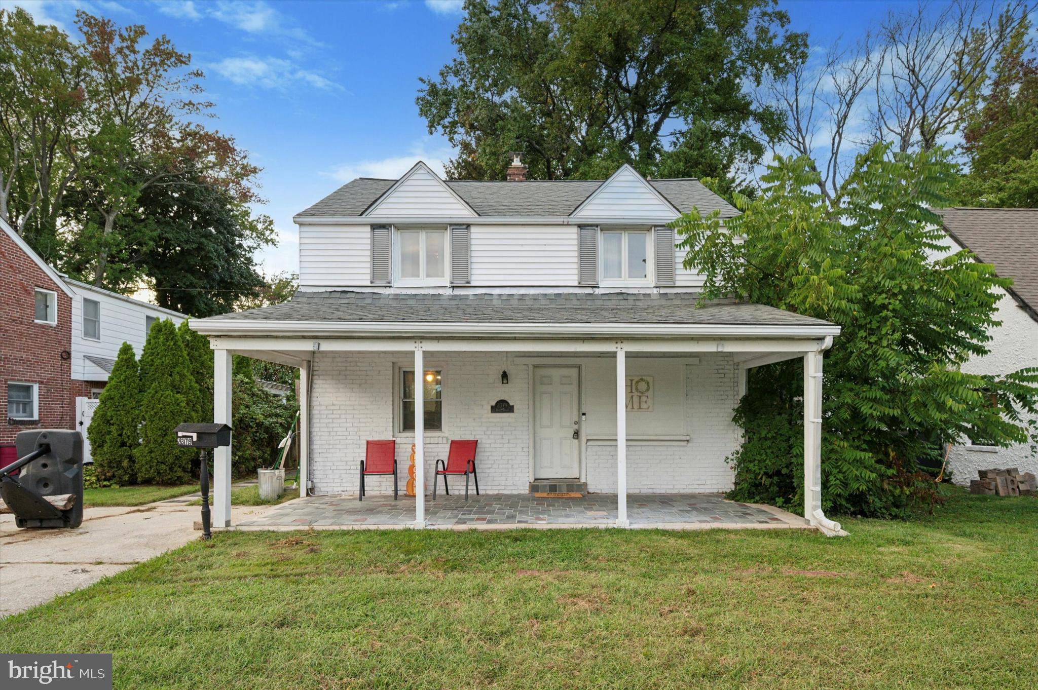 2379 Mole Road Secane, PA 19018 - Photo 2 of 26 a front view of a house with a yard and trees
