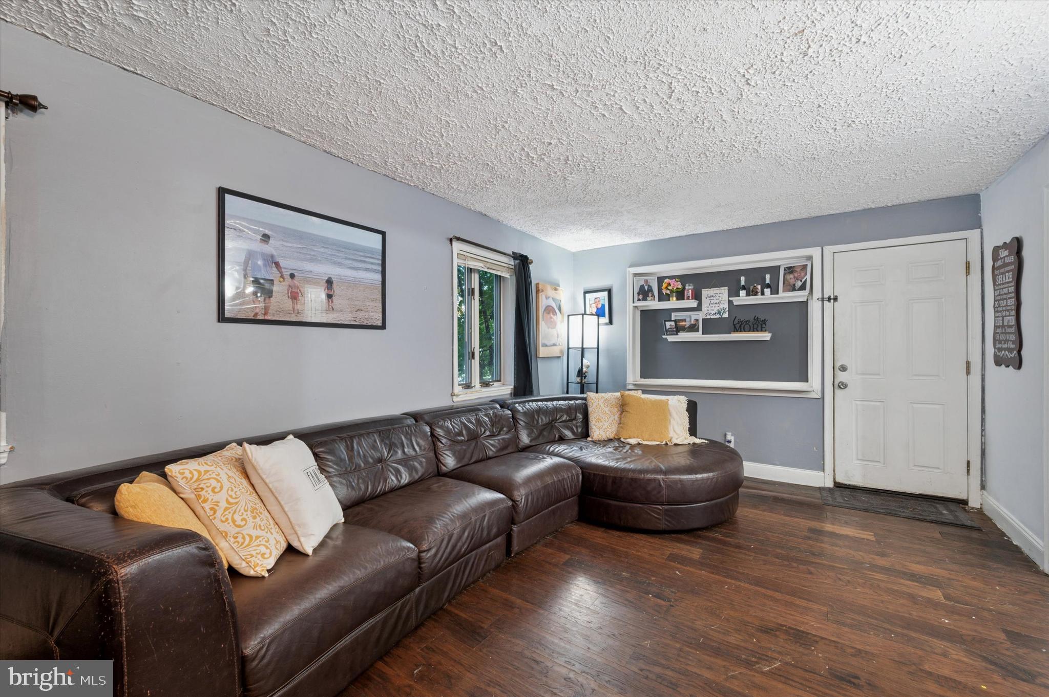 2379 Mole Road Secane, PA 19018 - Photo 6 of 26 a living room with a couch and a wooden floor
