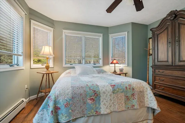 a view of a park with trees and a sign