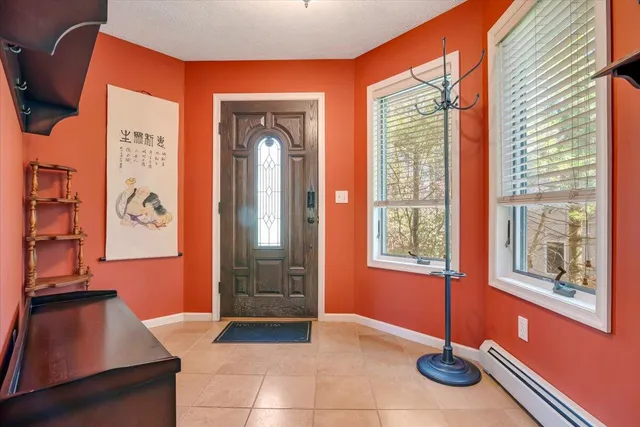a kitchen with stainless steel appliances granite countertop a refrigerator and a stove