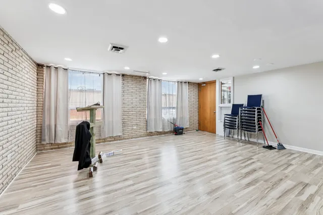 a view of room with furniture and wooden floor