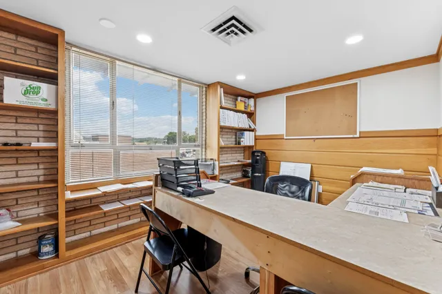 a view of a workspace with furniture