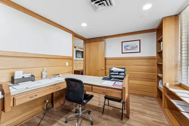 a living room with furniture and floor to ceiling window