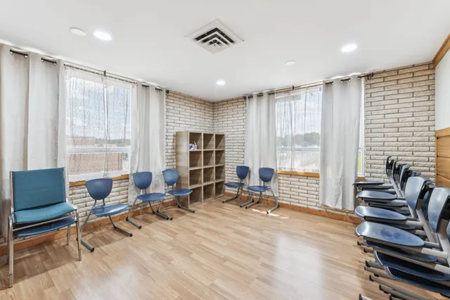 a view of a livingroom with furniture and a chair