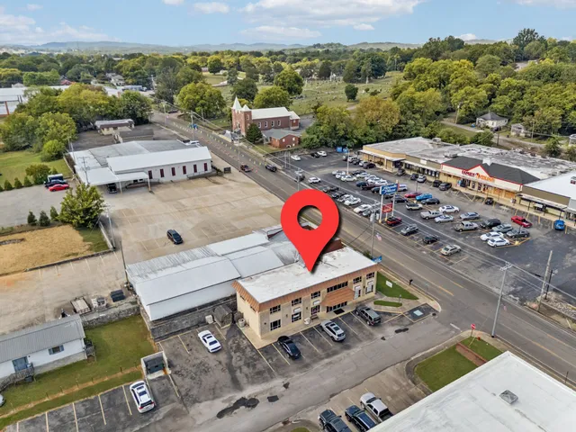 an aerial view of a house with a ocean view