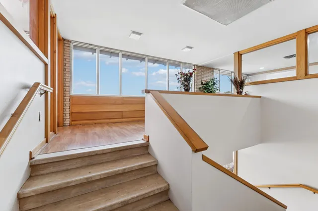 an aerial view of residential houses with city view
