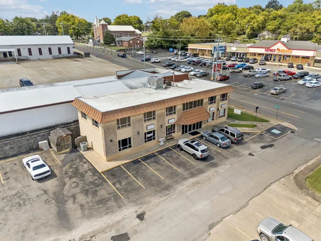 a view of a room with furniture and wooden floor