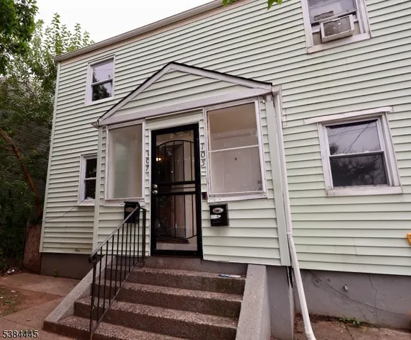 a front view of a house with a balcony