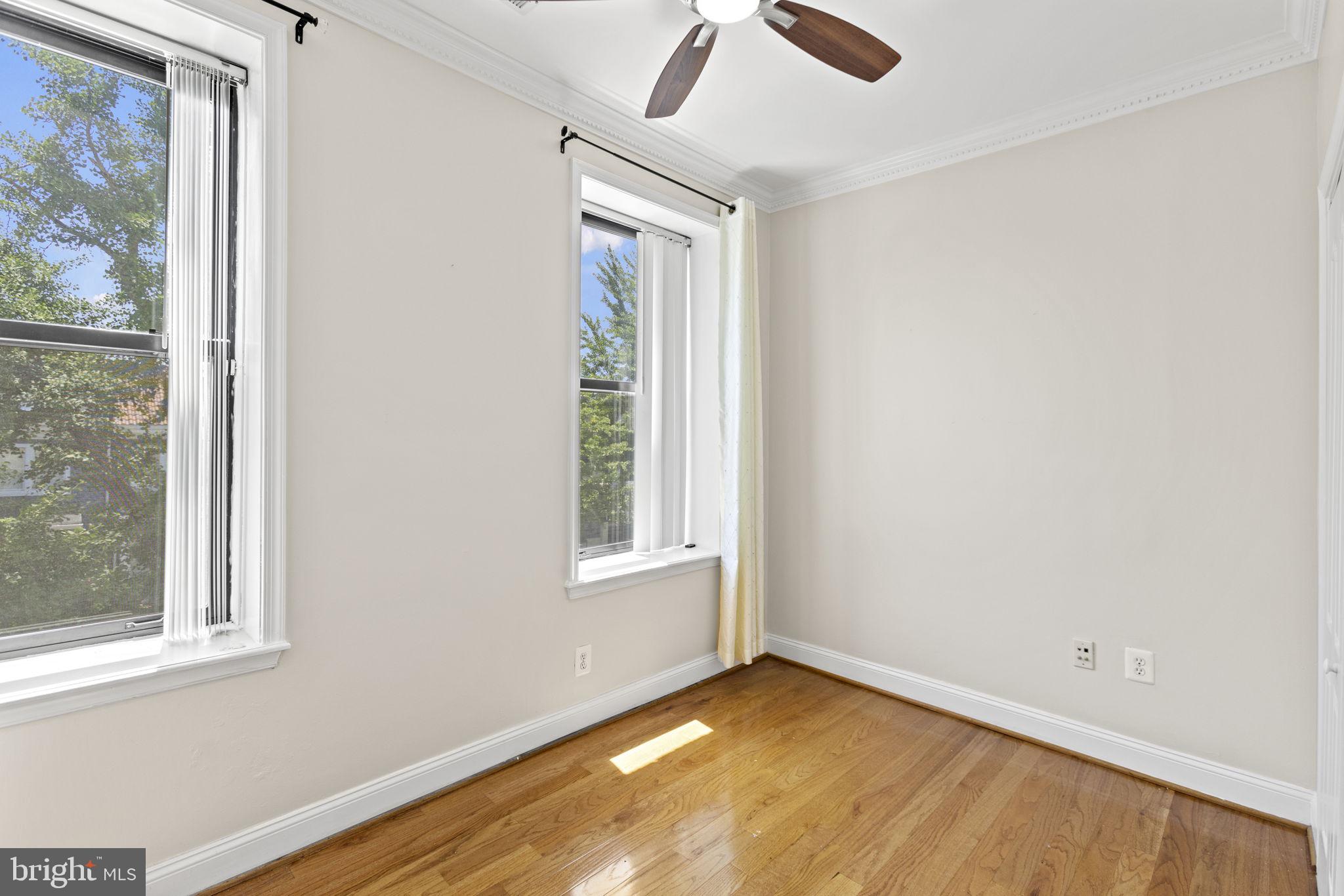 1437 Spring Road Northwest, Unit 21 Washington, DC 20010 - Photo 16 of 25 an empty room with windows