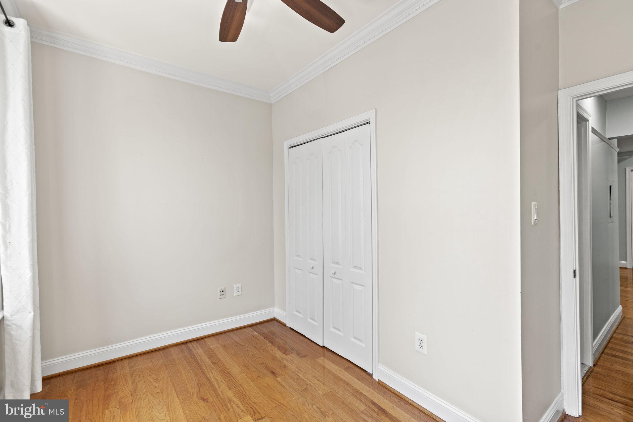 1437 Spring Road Northwest, Unit 21 Washington, DC 20010 - Photo 17 of 25 an empty room with floor to ceiling window