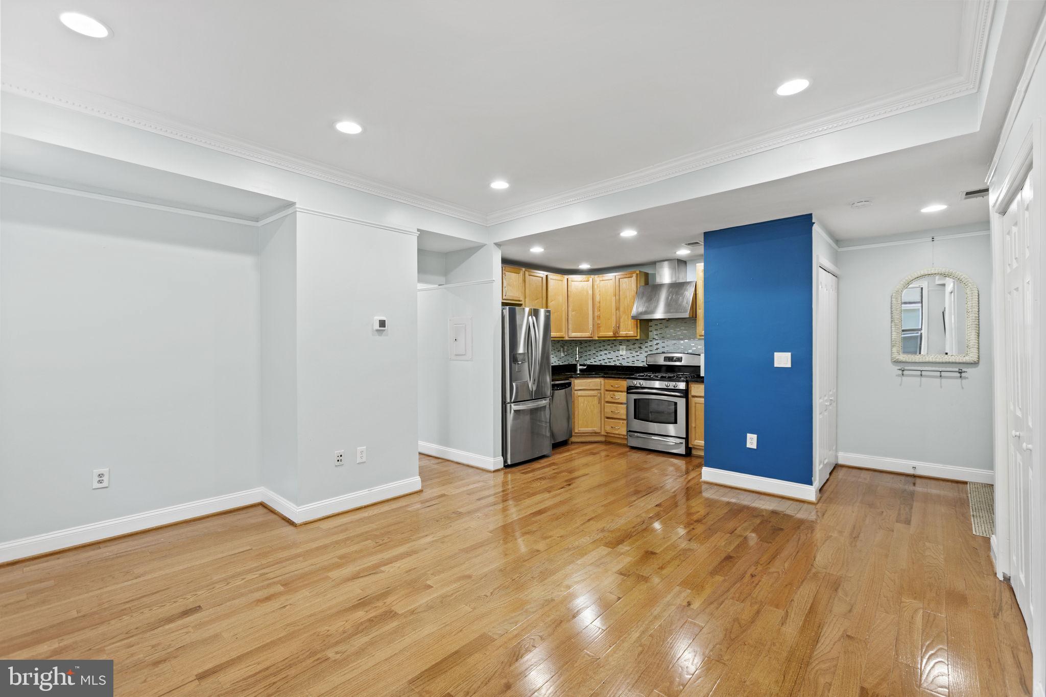 1437 Spring Road Northwest, Unit 21 Washington, DC 20010 - Photo 10 of 25 a view of kitchen with wooden floor