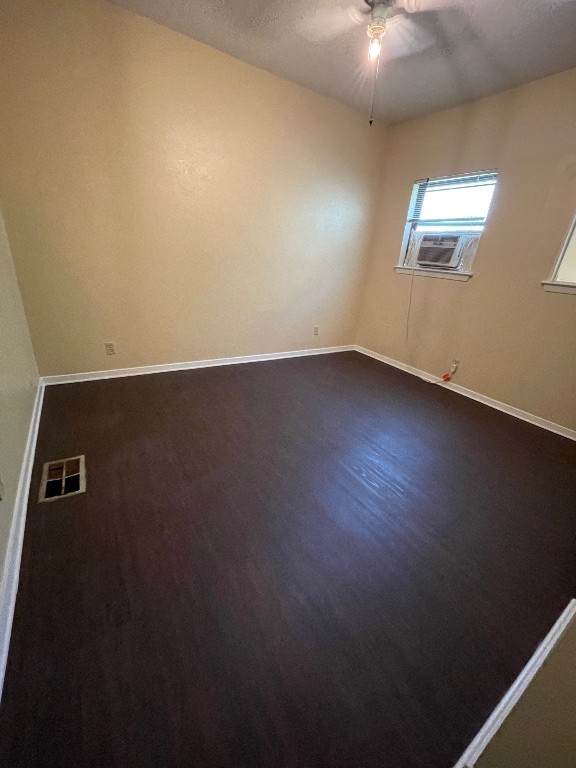 2110 Rio Grande Street, Unit 308 Austin, TX 78705 - Photo 12 of 14 an empty room with wooden floor and windows