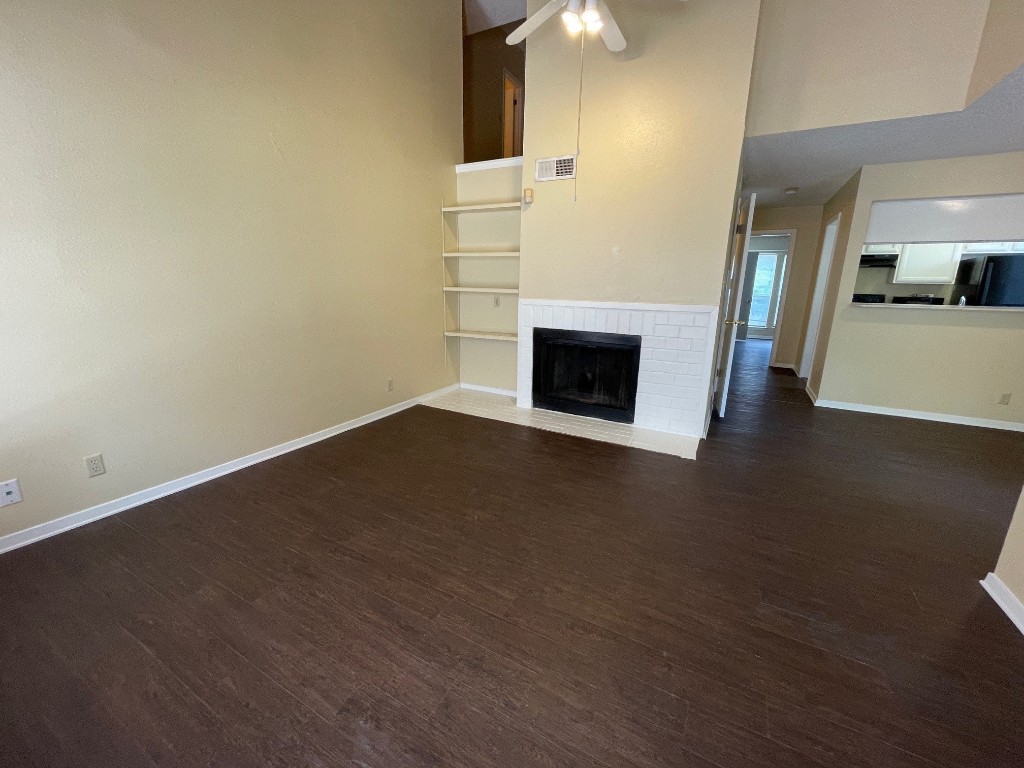 2110 Rio Grande Street, Unit 308 Austin, TX 78705 - Photo 4 of 14 a view of empty room with wooden floor