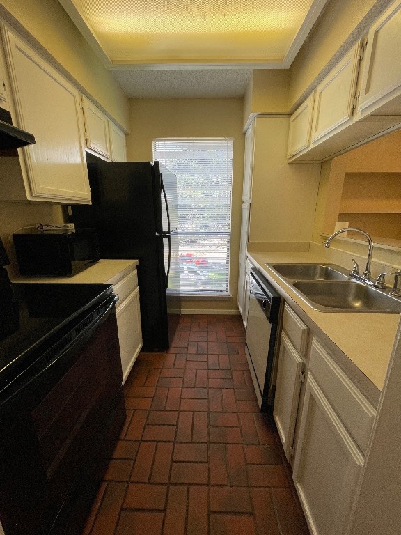 2110 Rio Grande Street, Unit 308 Austin, TX 78705 - Photo 5 of 14 a kitchen with a sink stove and refrigerator
