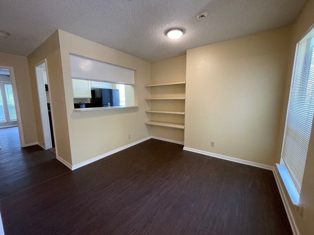 2110 Rio Grande Street, Unit 308 Austin, TX 78705 - Photo 6 of 14 a view of a livingroom with wooden floor
