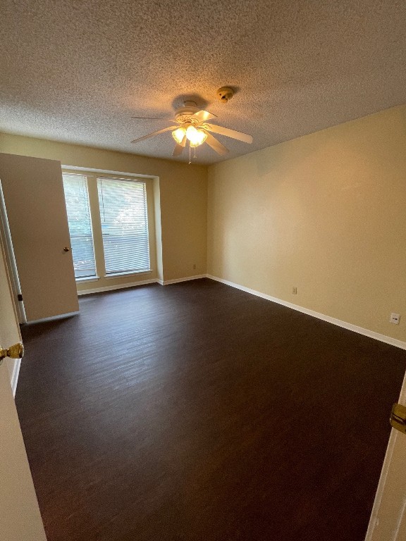 2110 Rio Grande Street, Unit 308 Austin, TX 78705 - Photo 7 of 14 a view of an empty room with window and wooden floor
