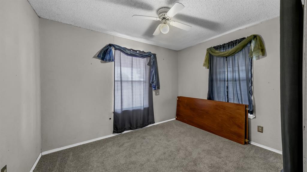 3200 Fairview Road Millsap, TX 76066 - Photo 16 of 33 a room with windows and ceiling fan