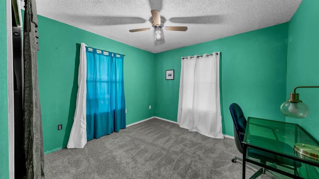 3200 Fairview Road Millsap, TX 76066 - Photo 19 of 33 a view of a livingroom with furniture and a ceiling fan