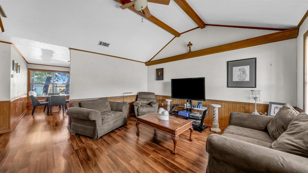 3200 Fairview Road Millsap, TX 76066 - Photo 2 of 33 a living room with furniture and a flat screen tv