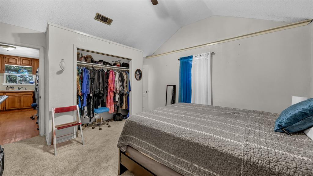 3200 Fairview Road Millsap, TX 76066 - Photo 22 of 33 a bed room with a bed and a window