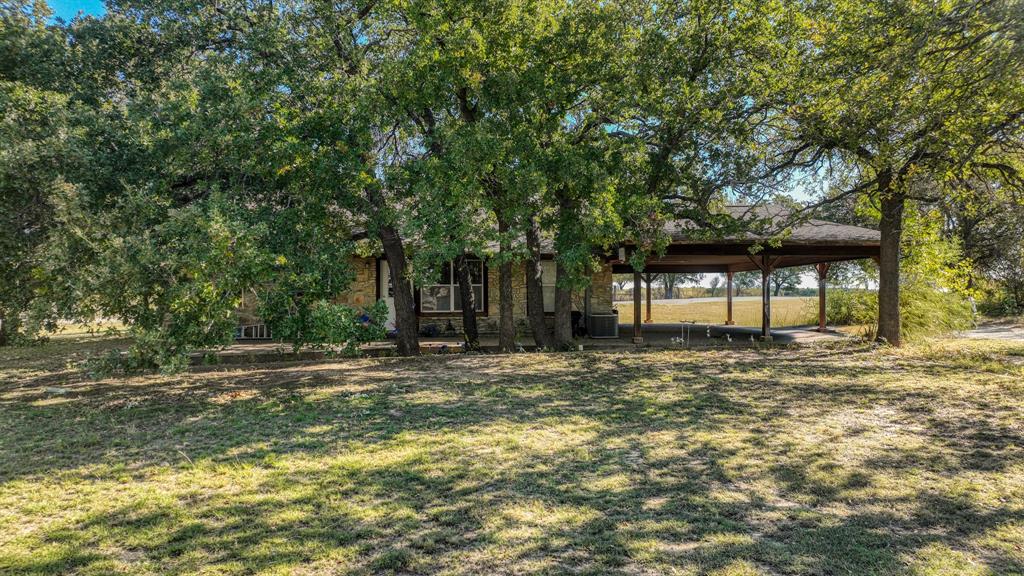 3200 Fairview Road Millsap, TX 76066 - Photo 24 of 33 a view of a house with a yard