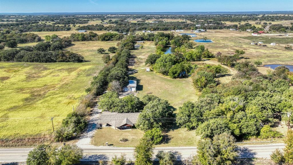 3200 Fairview Road Millsap, TX 76066 - Photo 26 of 33 an aerial view of residential houses with outdoor space