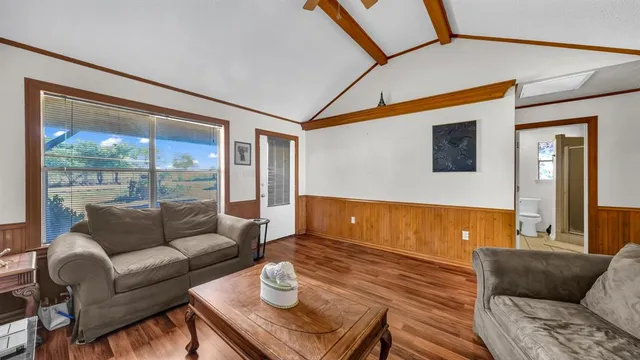 a living room with furniture and a window
