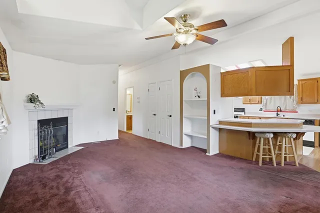 a spacious bedroom with a bed and a chandelier