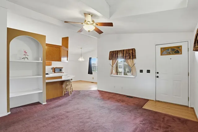 a view of workspace with cabinet and window