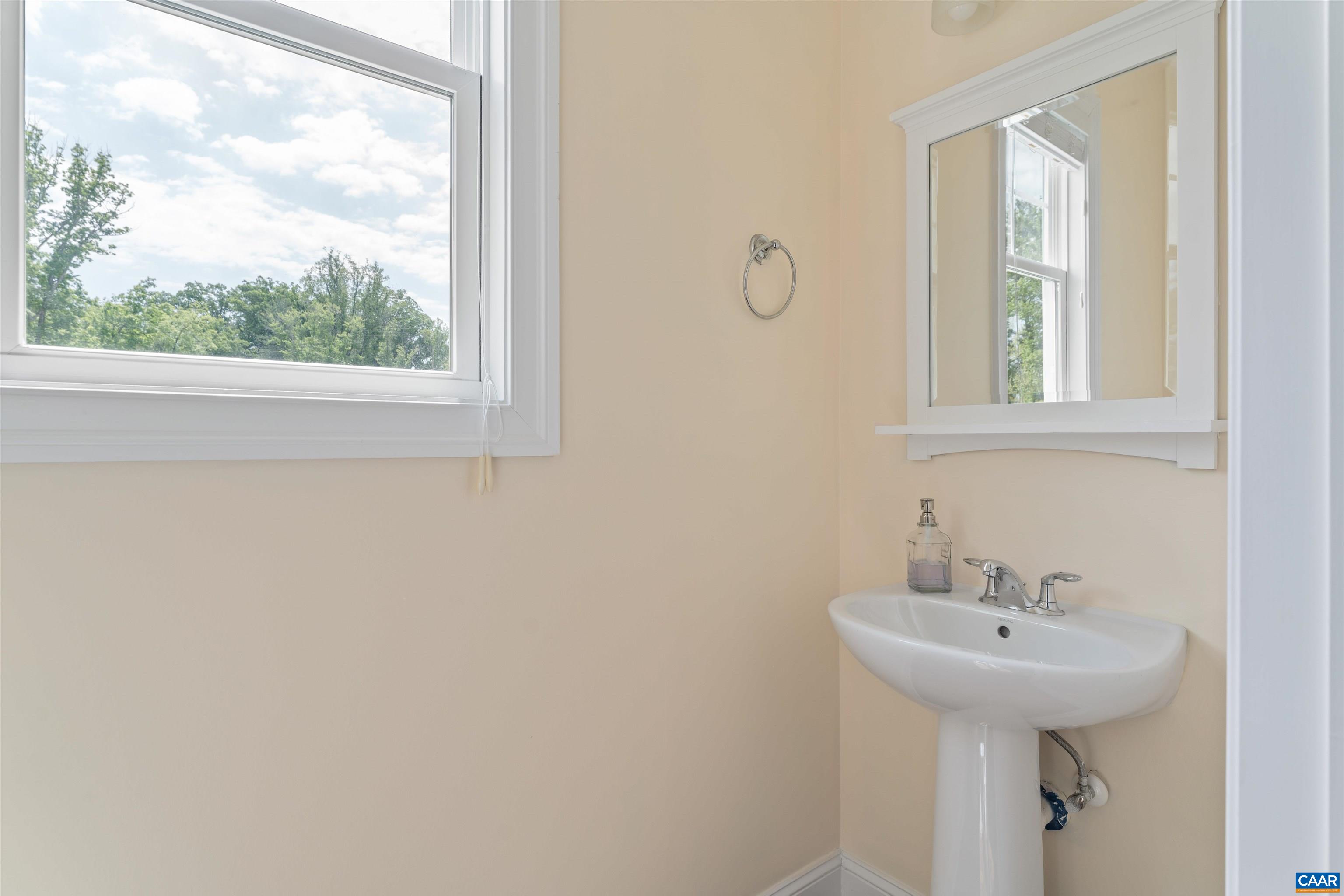 322 Claibourne Road Crozet, VA 22932 - Photo 12 of 25 a bathroom with a sink and a window