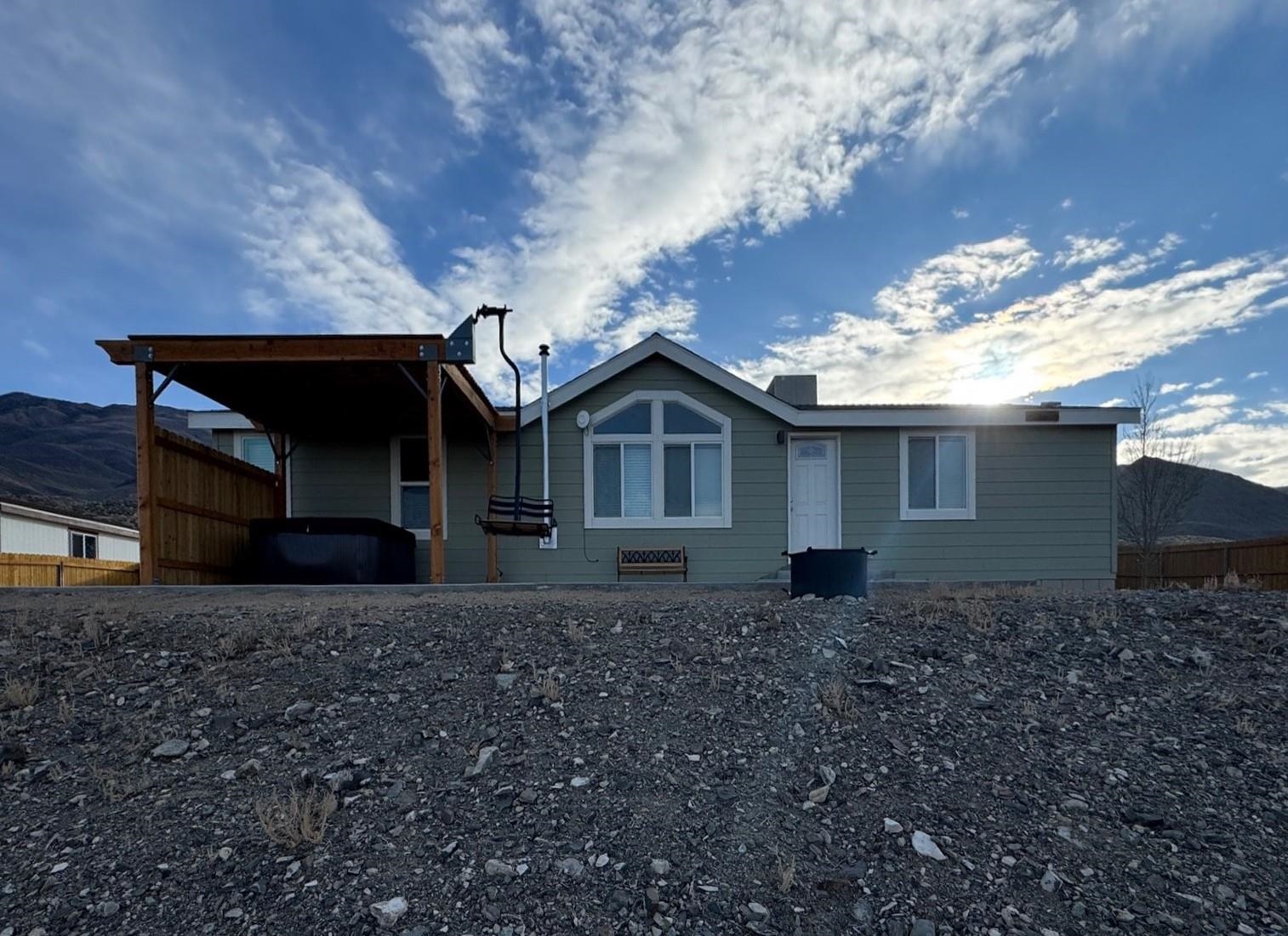 139 Tuolumne Road Bishop, CA 93514 - Photo 13 of 18 a front view of a house with trees