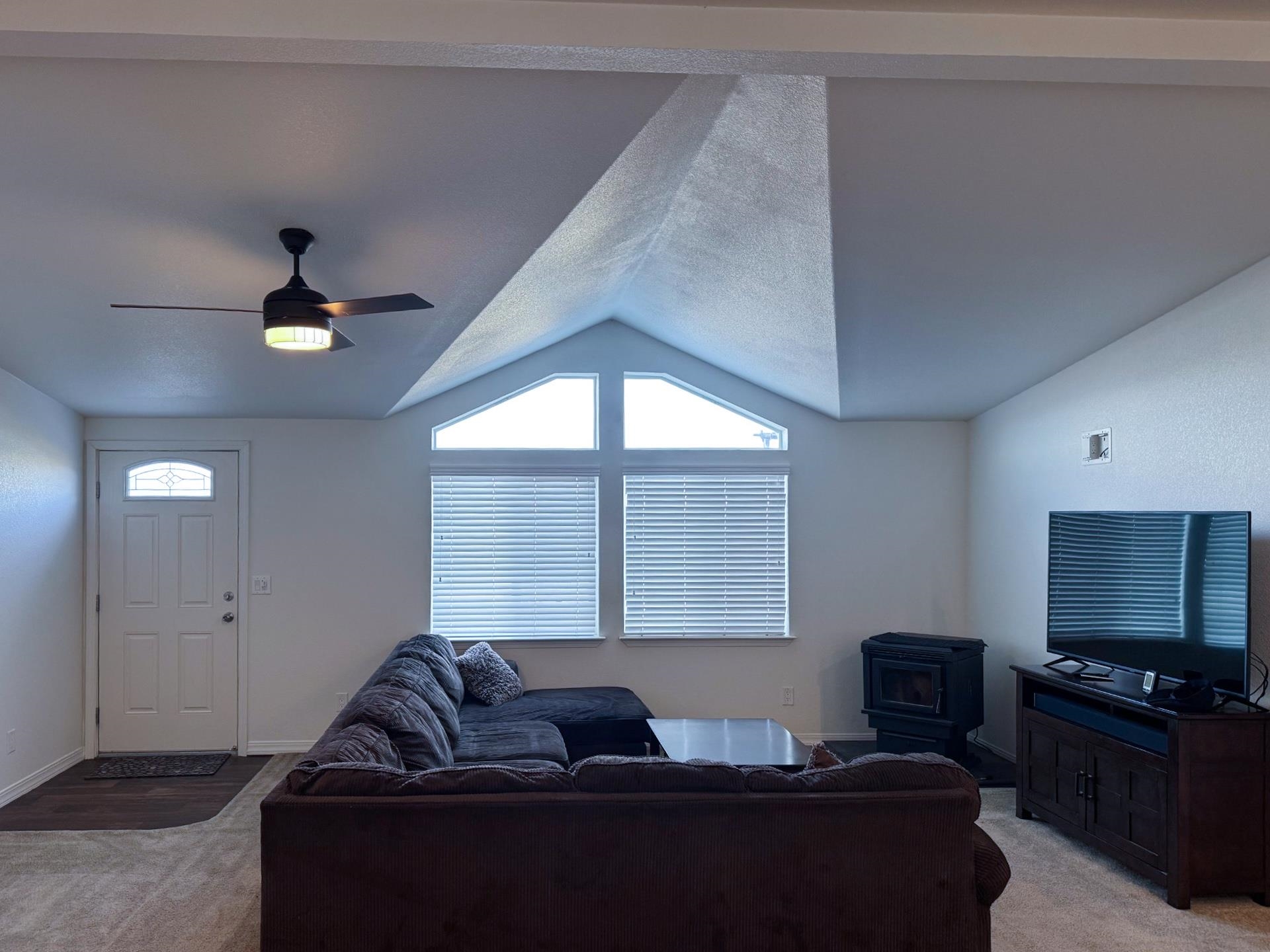 139 Tuolumne Road Bishop, CA 93514 - Photo 2 of 18 a living room with furniture and a flat screen tv