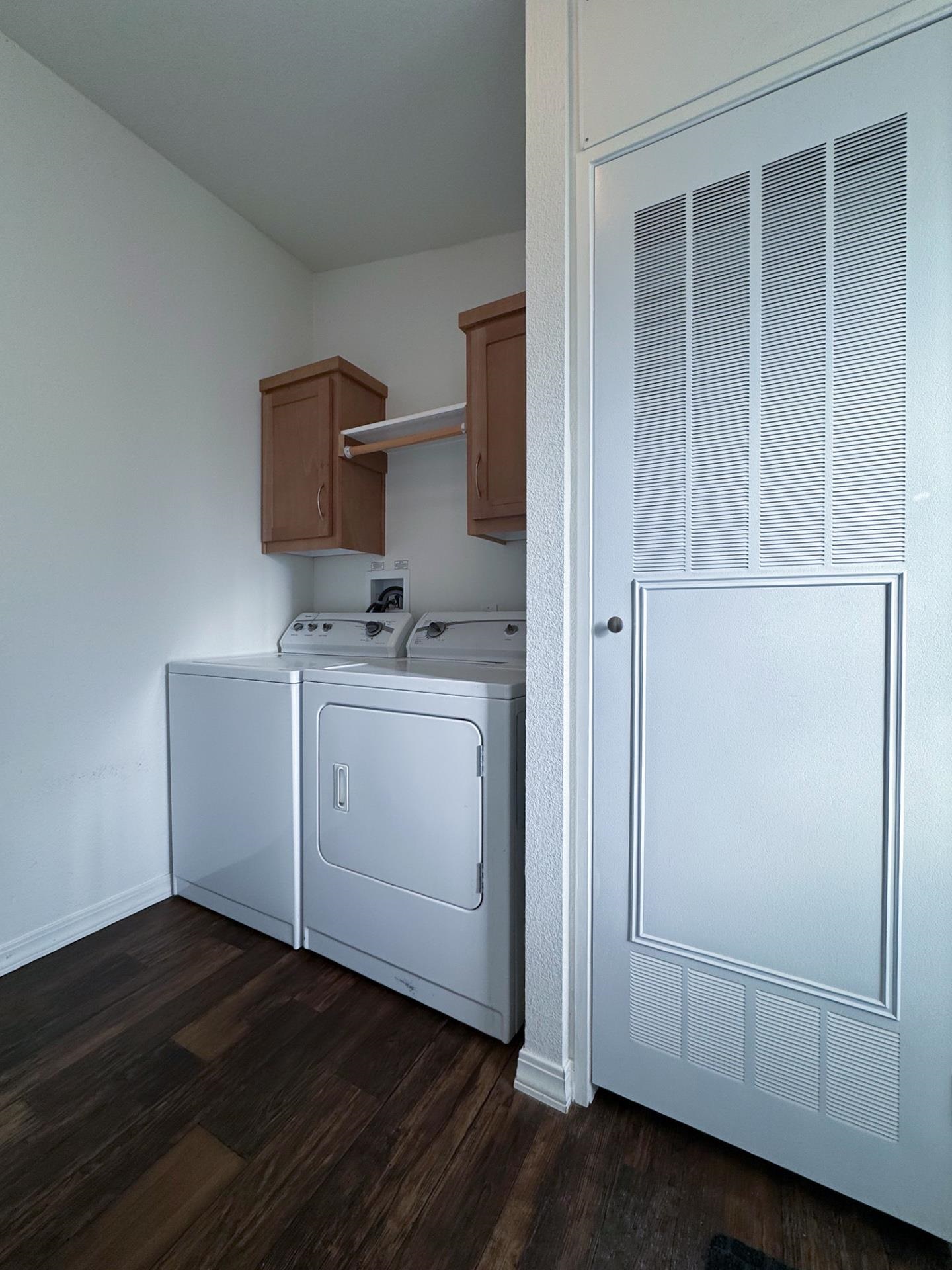 139 Tuolumne Road Bishop, CA 93514 - Photo 6 of 18 a utility room with cabinets washer and dryer