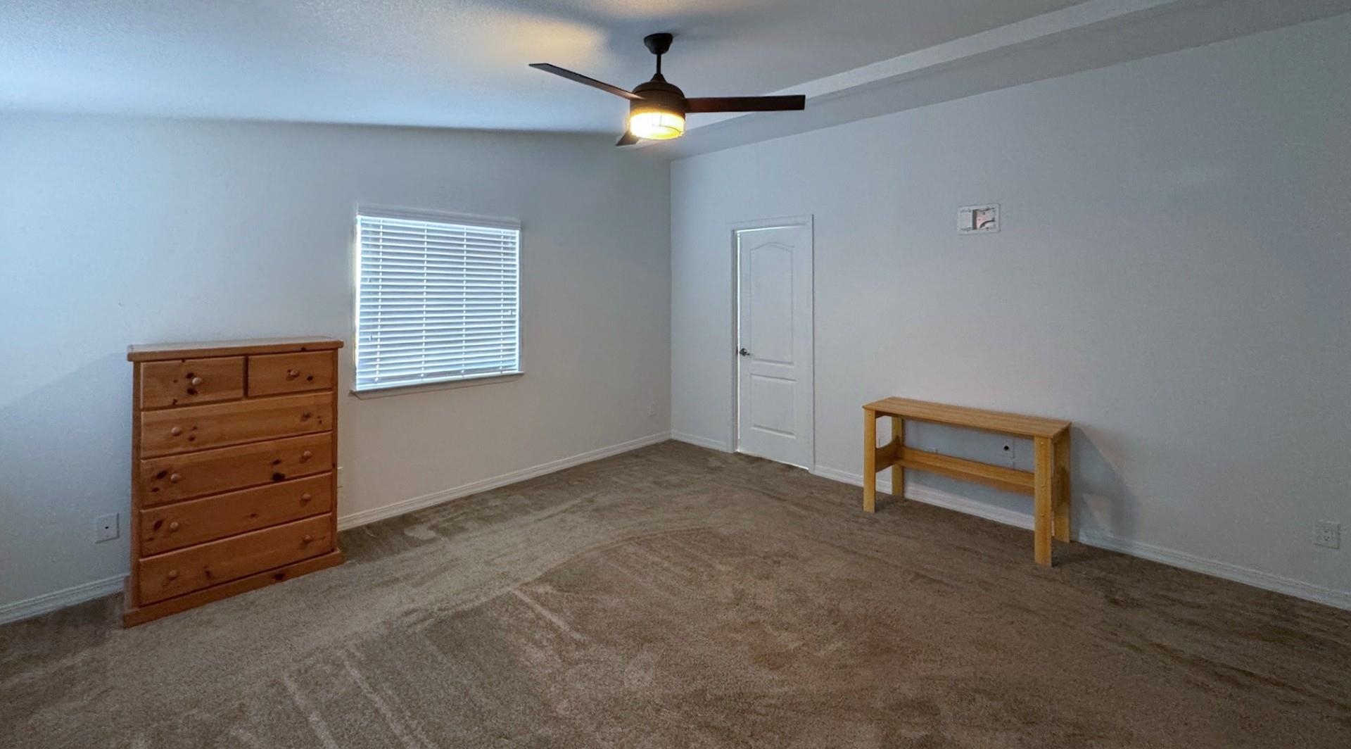 139 Tuolumne Road Bishop, CA 93514 - Photo 9 of 18 an empty room with furniture and a ceiling fan