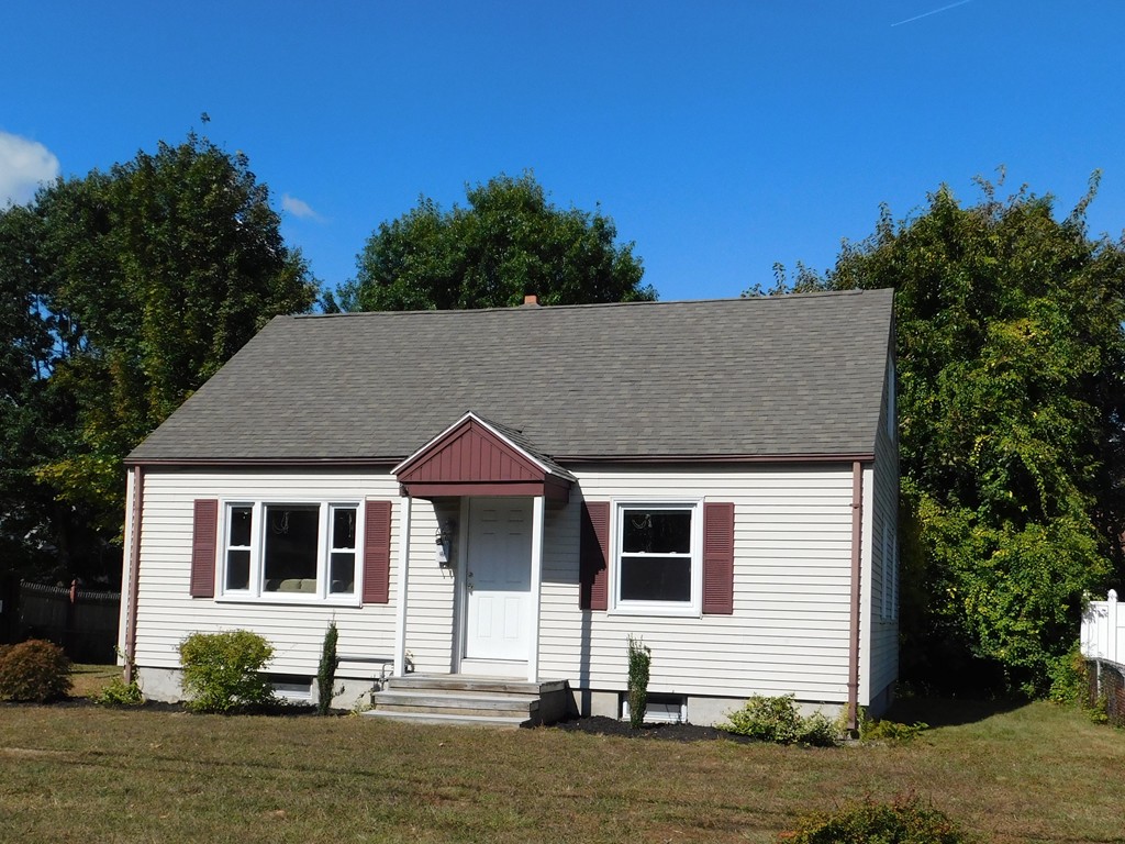 66 Notre Dame Street Springfield, MA 01104 - Photo 1 of 28 a front view of a house with a yard