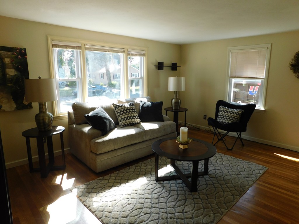 66 Notre Dame Street Springfield, MA 01104 - Photo 11 of 28 a living room with furniture and a window