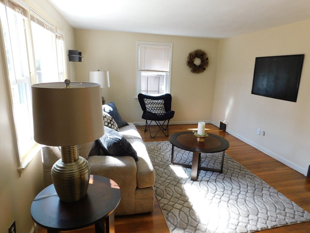 66 Notre Dame Street Springfield, MA 01104 - Photo 12 of 28 a living room with furniture and a window