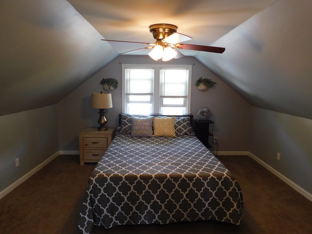 66 Notre Dame Street Springfield, MA 01104 - Photo 22 of 28 a bedroom with a bed and window