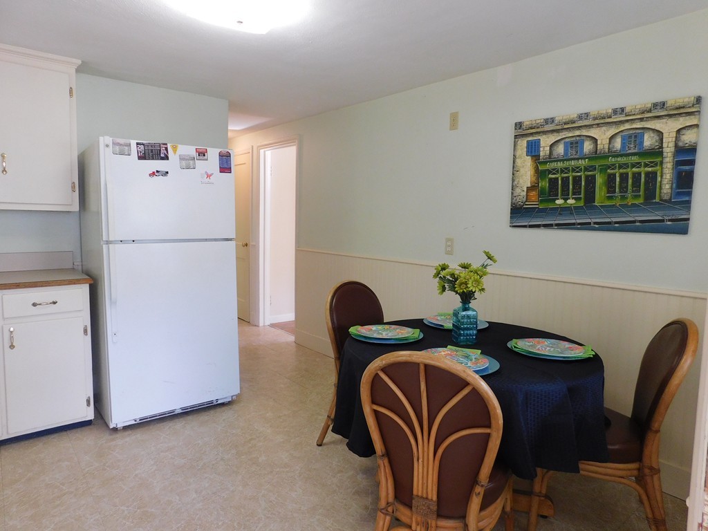 66 Notre Dame Street Springfield, MA 01104 - Photo 7 of 28 a dining room with furniture and refrigerator