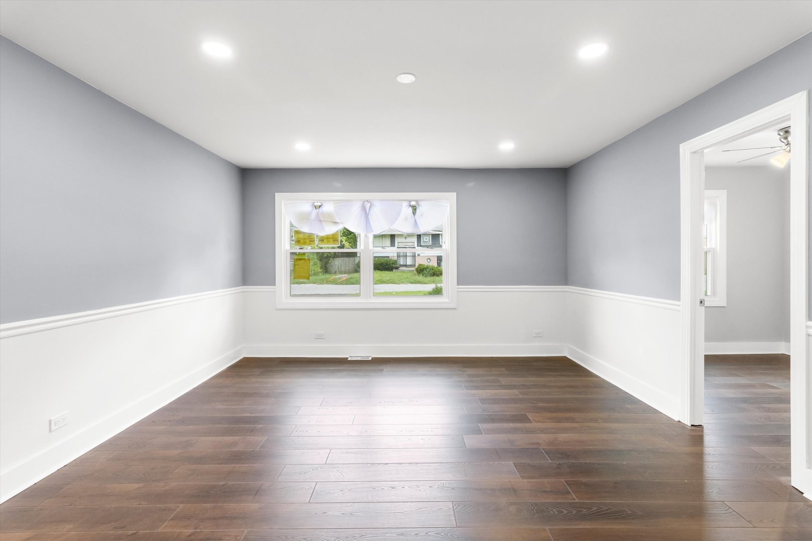 16510 Marshfield Avenue Markham, IL 60428 - Photo 33 of 38 an empty room with wooden floor and windows