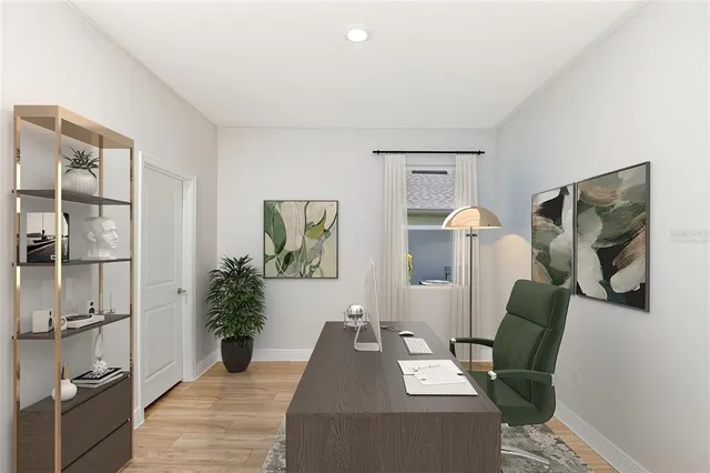 a living room with furniture and a potted plant