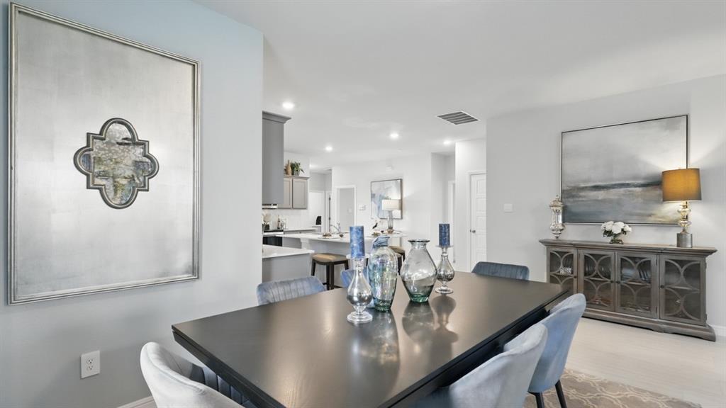 1205 Tree House Lane Decatur, TX 76234 - Photo 10 of 35 a view of kitchen island with stainless steel appliances
