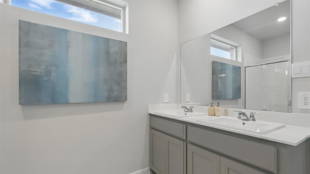 1205 Tree House Lane Decatur, TX 76234 - Photo 20 of 35 a bathroom with a sink and a mirror