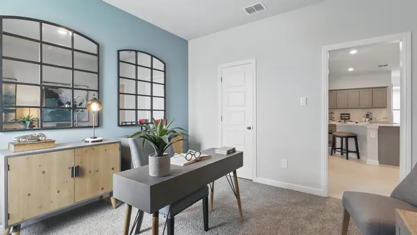 a dining room with furniture and a mirror