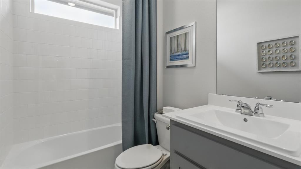 1205 Tree House Lane Decatur, TX 76234 - Photo 28 of 35 a bathroom with a sink toilet and shower